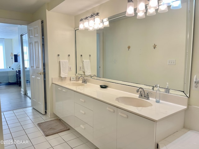 bathroom with tile patterned flooring and vanity