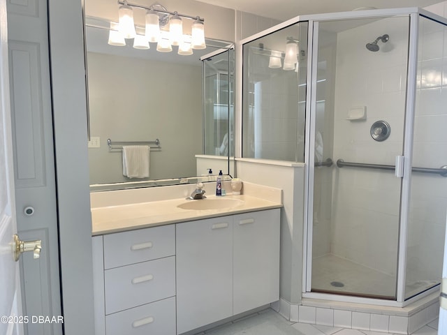 bathroom with walk in shower and vanity