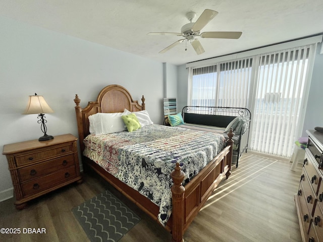 bedroom with wood-type flooring and ceiling fan