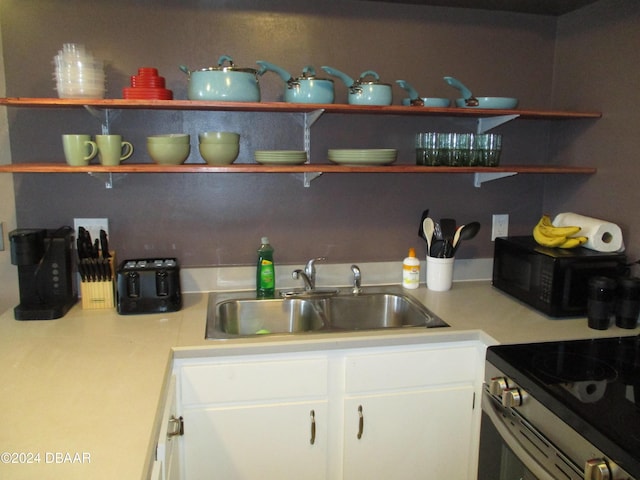 kitchen with white cabinets and sink