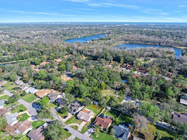 drone / aerial view with a water view