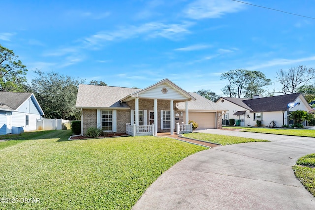 view of front facade featuring a front lawn, covered porch, and a garage