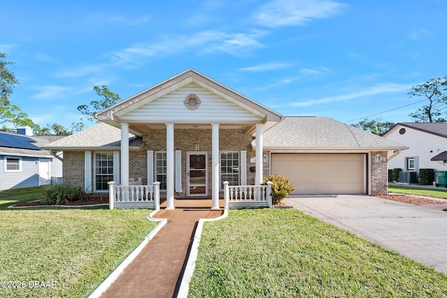 view of front facade with a porch, a garage, and a front yard