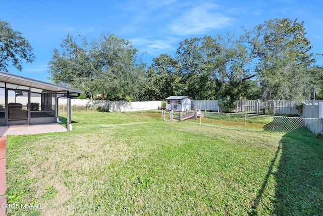 view of yard featuring a sunroom