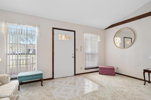 foyer entrance featuring lofted ceiling