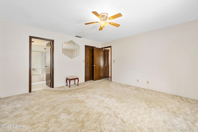 carpeted empty room with ceiling fan