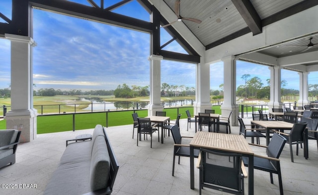 view of patio / terrace featuring a ceiling fan, outdoor dining area, a water view, and outdoor lounge area