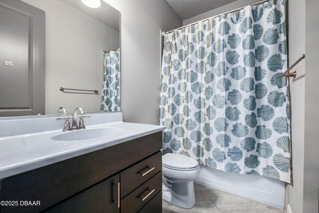 bathroom with toilet, shower / bath combo with shower curtain, and vanity