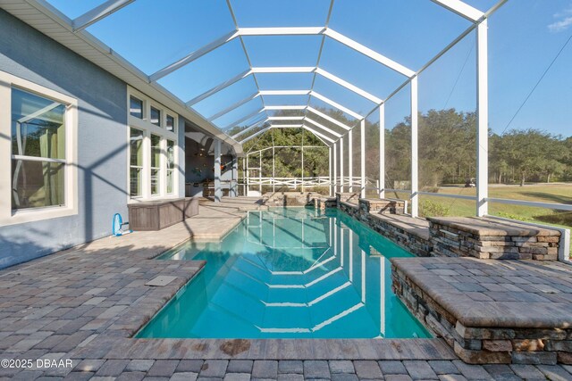 pool featuring a lanai and a patio