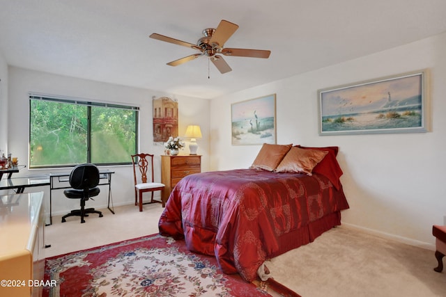 bedroom with light carpet and ceiling fan