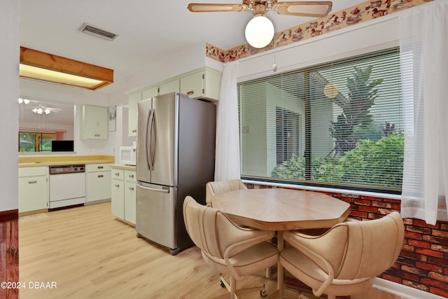 kitchen featuring white appliances, light hardwood / wood-style flooring, and ceiling fan