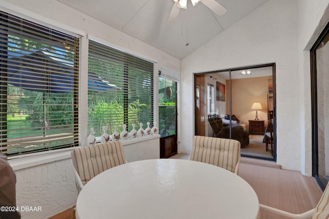 dining room with vaulted ceiling, plenty of natural light, and ceiling fan