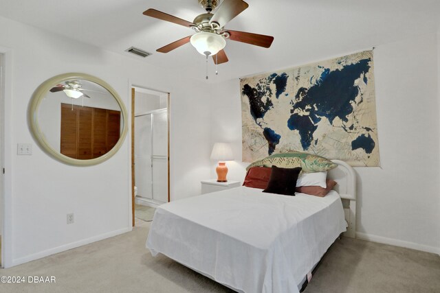 bedroom featuring ceiling fan and light carpet