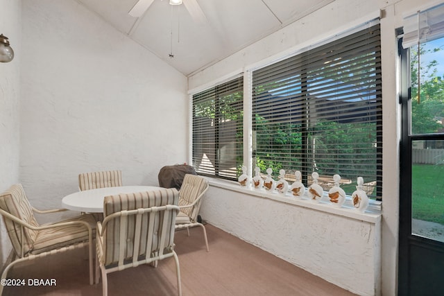 sunroom featuring ceiling fan and lofted ceiling