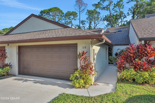 single story home featuring a garage