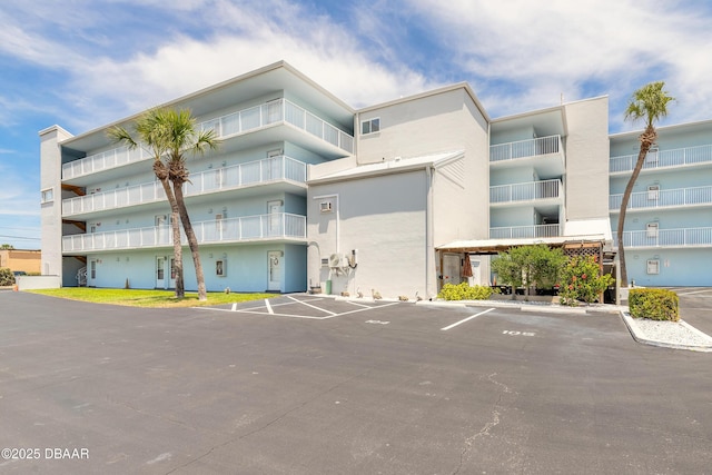 view of property with uncovered parking