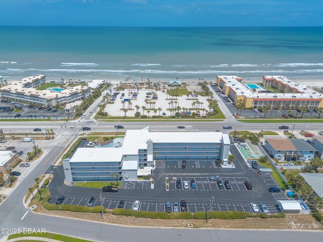 bird's eye view with a water view and a view of the beach