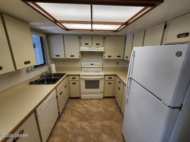 kitchen with white appliances, sink, and tile patterned flooring