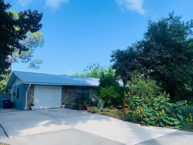 single story home with a garage