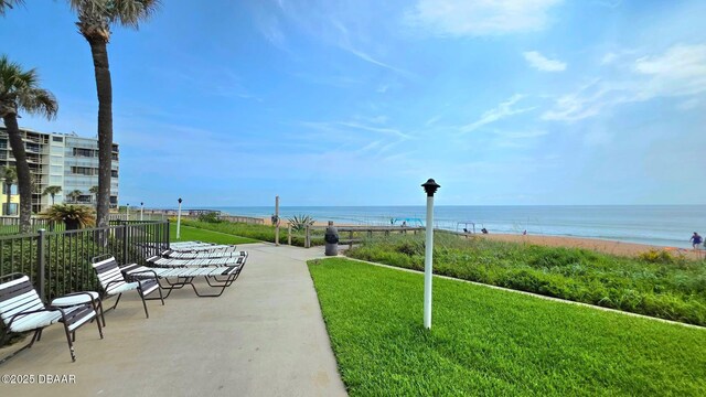 1275 Ocean Shore Blvd Unit 206, Ormond Beach, FL 32176 - view of property's community featuring a water view and a lawn