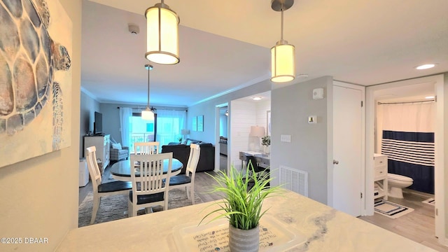 1275 Ocean Shore Blvd Unit 206, Ormond Beach, FL 32176 - dining room with wood finished floors, crown molding, and recessed lighting