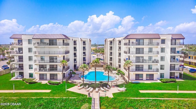 1275 Ocean Shore Blvd Unit 206, Ormond Beach, FL 32176 - view of apartment building / complex featuring a community pool