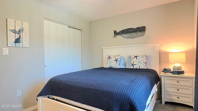 1275 Ocean Shore Blvd Unit 206, Ormond Beach, FL 32176 - bedroom with dark colored carpet, baseboards, and a closet