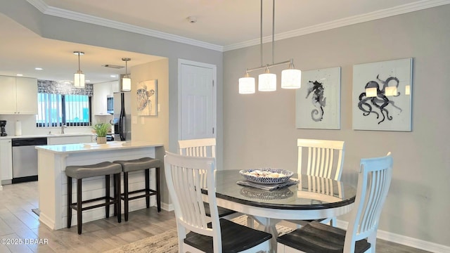 1275 Ocean Shore Blvd Unit 206, Ormond Beach, FL 32176 - dining space featuring light wood finished floors, ornamental molding, and baseboards
