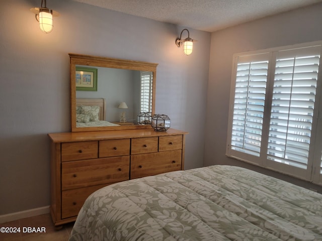 bedroom featuring a textured ceiling