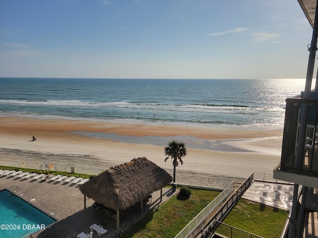 water view with a gazebo and a beach view