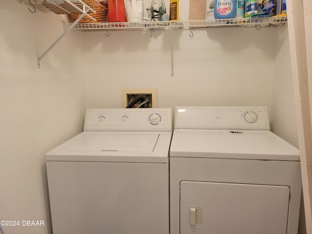 laundry area with washing machine and dryer