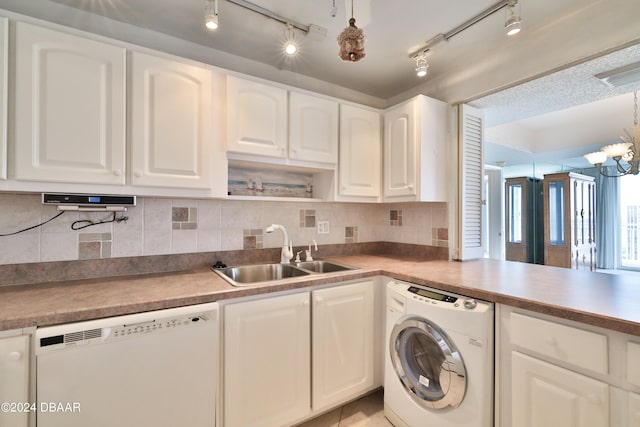 kitchen featuring white cabinetry, white dishwasher, washer / clothes dryer, sink, and rail lighting