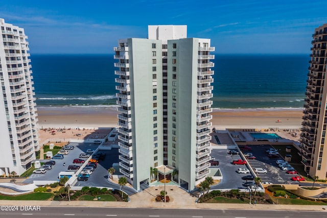 bird's eye view with a beach view and a water view