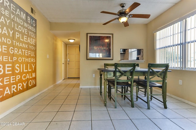 dining area featuring light tile patterned floors and ceiling fan