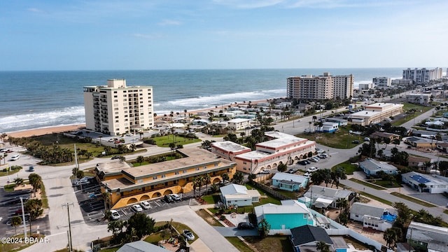 drone / aerial view with a view of the beach and a water view