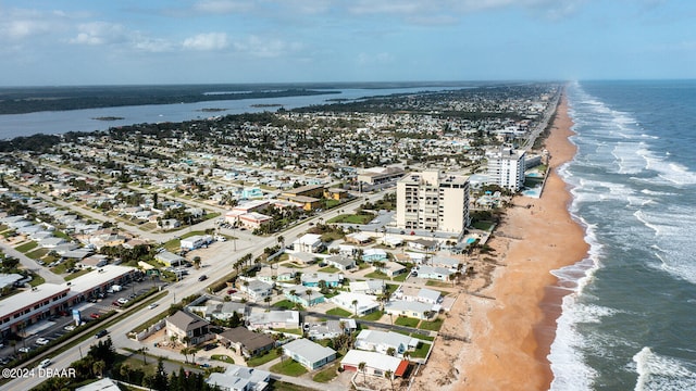 bird's eye view with a view of the beach and a water view