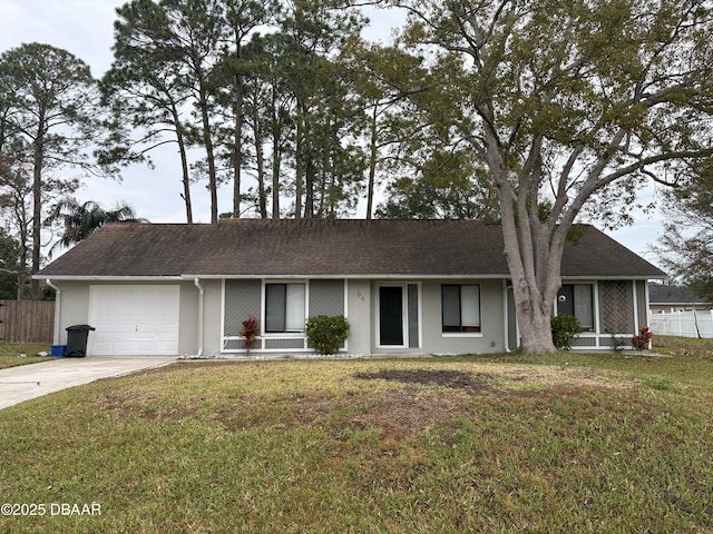 ranch-style house featuring a garage and a front yard