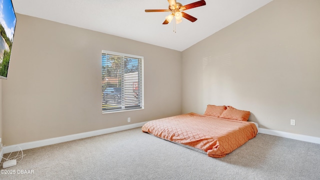 carpeted bedroom featuring vaulted ceiling and ceiling fan