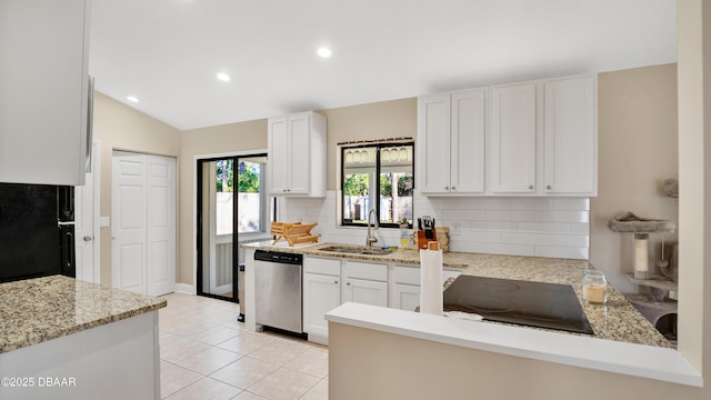 kitchen with sink, light tile patterned floors, white cabinetry, black electric cooktop, and stainless steel dishwasher