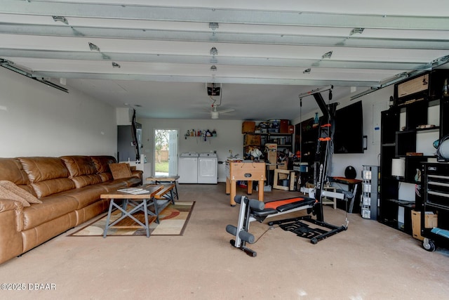 garage with a garage door opener and washing machine and dryer