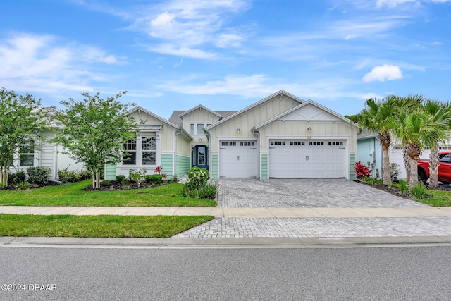 view of front of house with a front yard and a garage