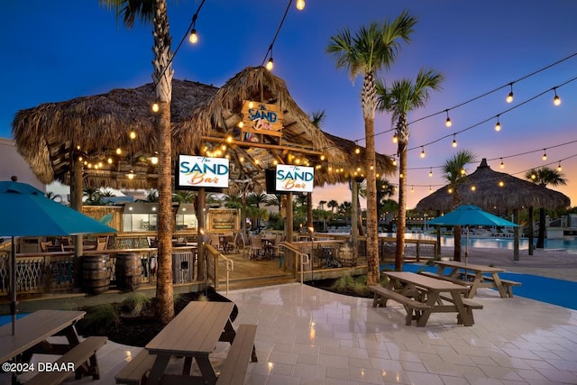 view of community with a mountain view and a patio