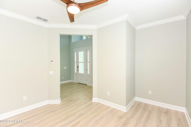 unfurnished room featuring crown molding, light hardwood / wood-style flooring, and ceiling fan