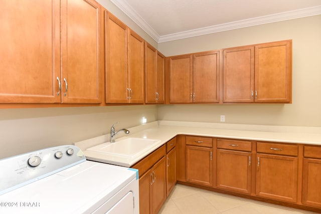 washroom with sink, cabinets, washer / dryer, light tile patterned flooring, and ornamental molding