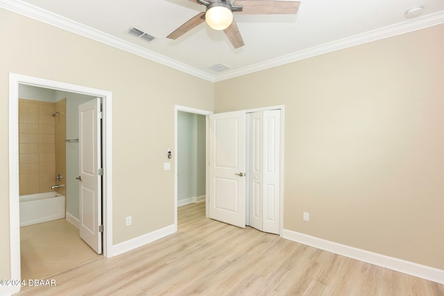 unfurnished bedroom featuring crown molding, ceiling fan, and light hardwood / wood-style floors