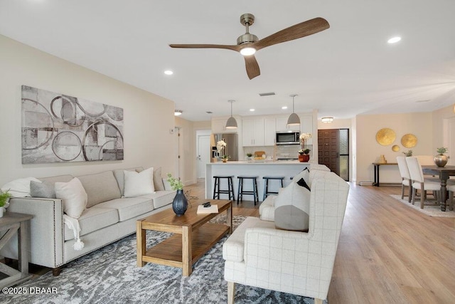 4 Sea Hawk Dr, Ormond Beach, FL 32176 - living room featuring ceiling fan, light wood-style flooring, and recessed lighting