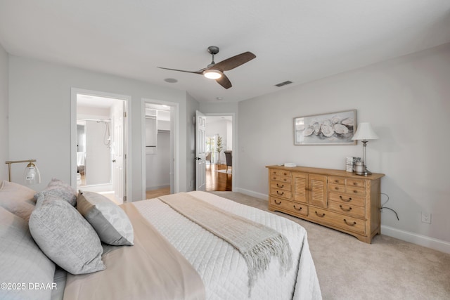 620 Middlebury Loop, New Smyrna Beach, FL 32168 - bedroom with light carpet, a spacious closet, and a ceiling fan