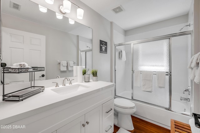 620 Middlebury Loop, New Smyrna Beach, FL 32168 - full bath featuring vanity, enclosed tub / shower combo, and wood finished floors