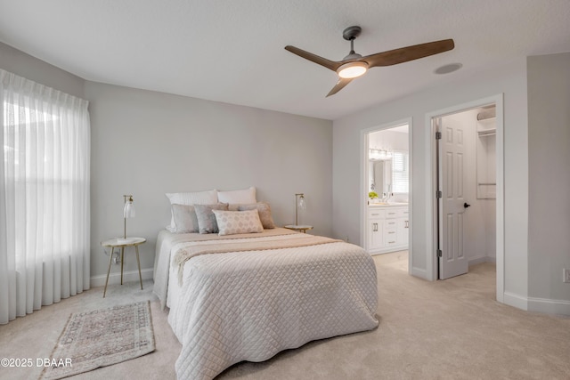 620 Middlebury Loop, New Smyrna Beach, FL 32168 - bedroom with light colored carpet, a spacious closet, ensuite bath, and a ceiling fan