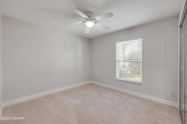 620 Middlebury Loop, New Smyrna Beach, FL 32168 - empty room featuring light carpet and a ceiling fan